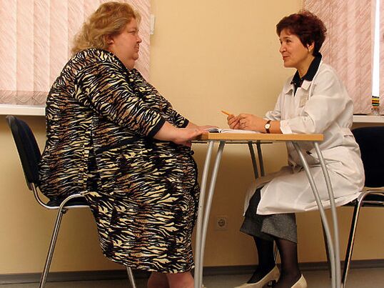 At the consultation of a phlebologist, a patient with varicose veins caused by obesity